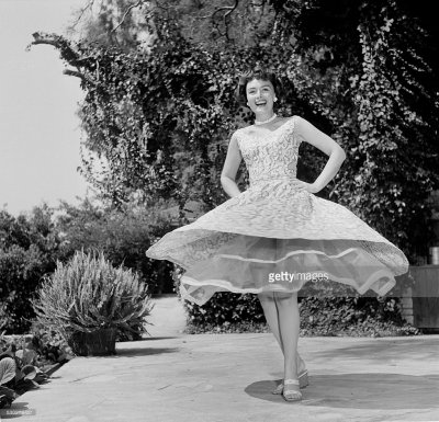 Donna Twirls in fancy dress at Hollywood home May 06 1954.jpg