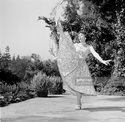 Donna Reed does the High Kick at her Hollywood Home.jpg