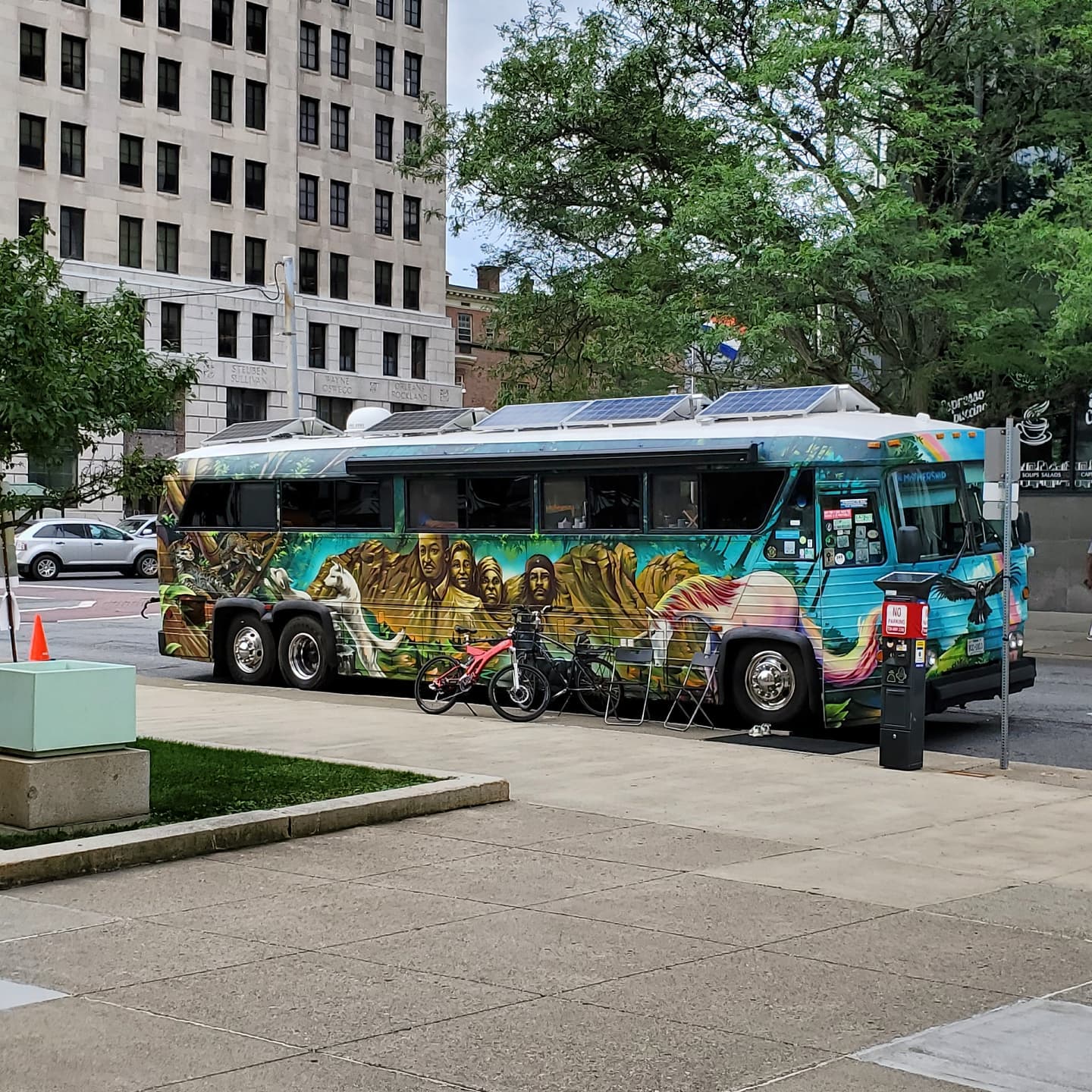 Woody Harrelson's solar-powered hippie bus parked outside my office. Photo by Adam L. in Albany, New York.