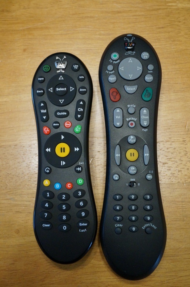 TiVo Roamio remote next to TiVo HD remote