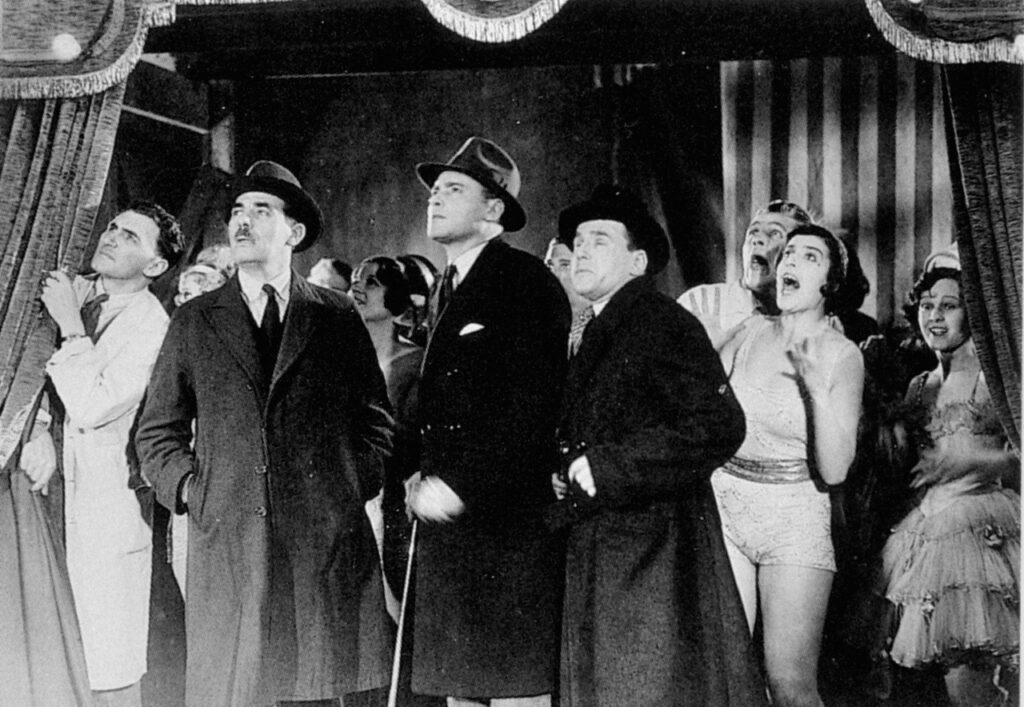 herbert-marshall-centre-with-cane-and-edward-chapman-with-binoculars-in-murder-1930-dir-alfred-hitchcock-1024x707.jpg