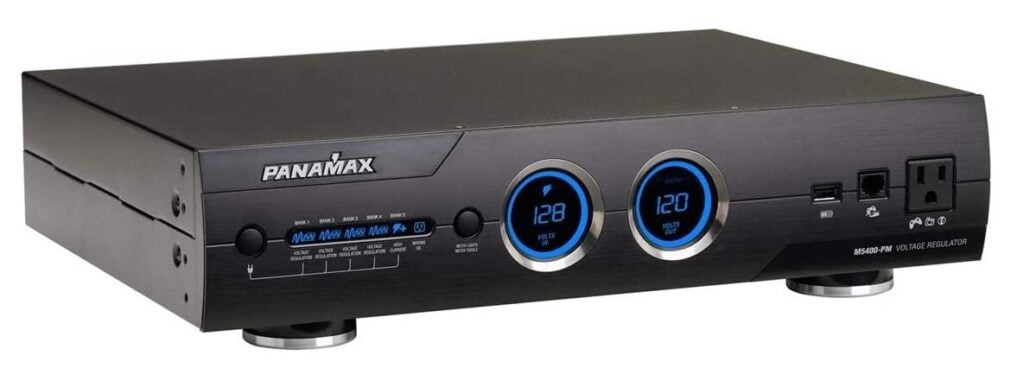 The Panamax M5400-PM Power Conditioner shown in a tilted manner, to give a full view of its depth as well as its front LED panel.